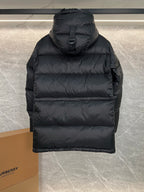 Dark long puffer jacket with hood, back view and horizontal quilted panels