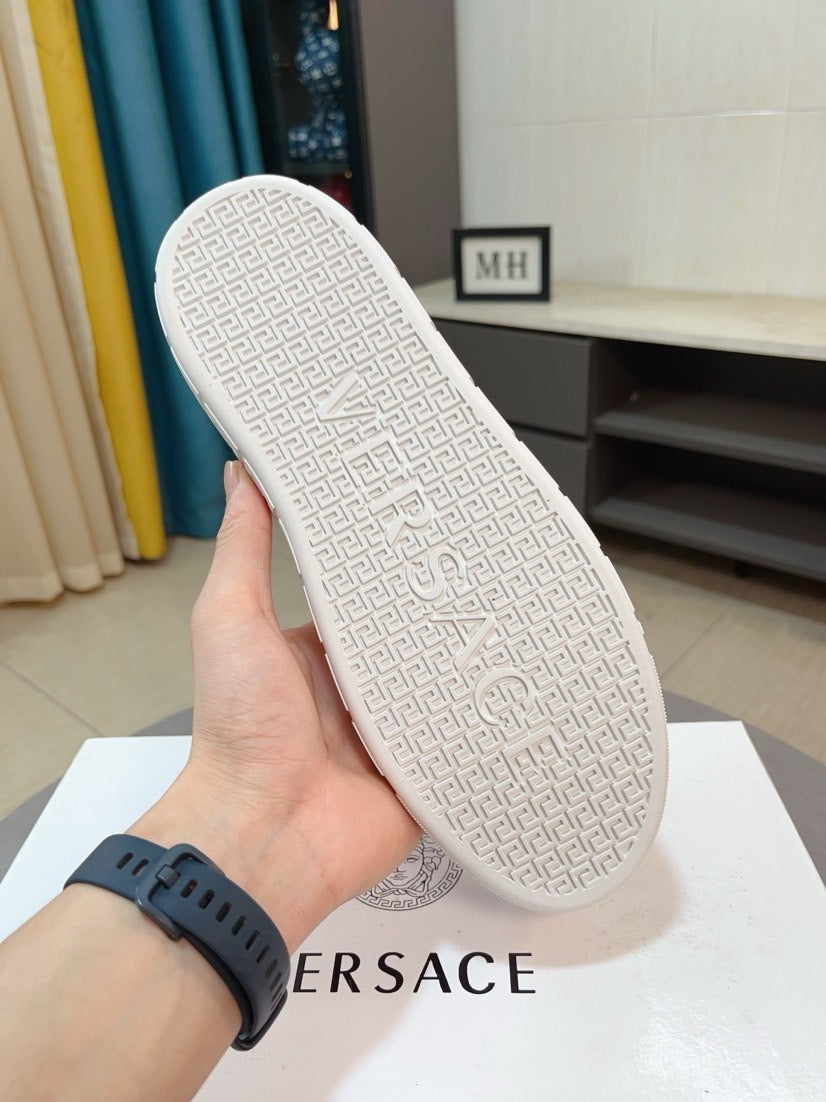 White sneaker outsole with embossed geometric pattern and traction tread