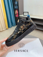 Black Versace high-top sneakers with gold Greca print and blue heel detail, lace-up