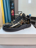 Black Versace high-top sneakers with gold Greca print, chunky sole, blue pull tab