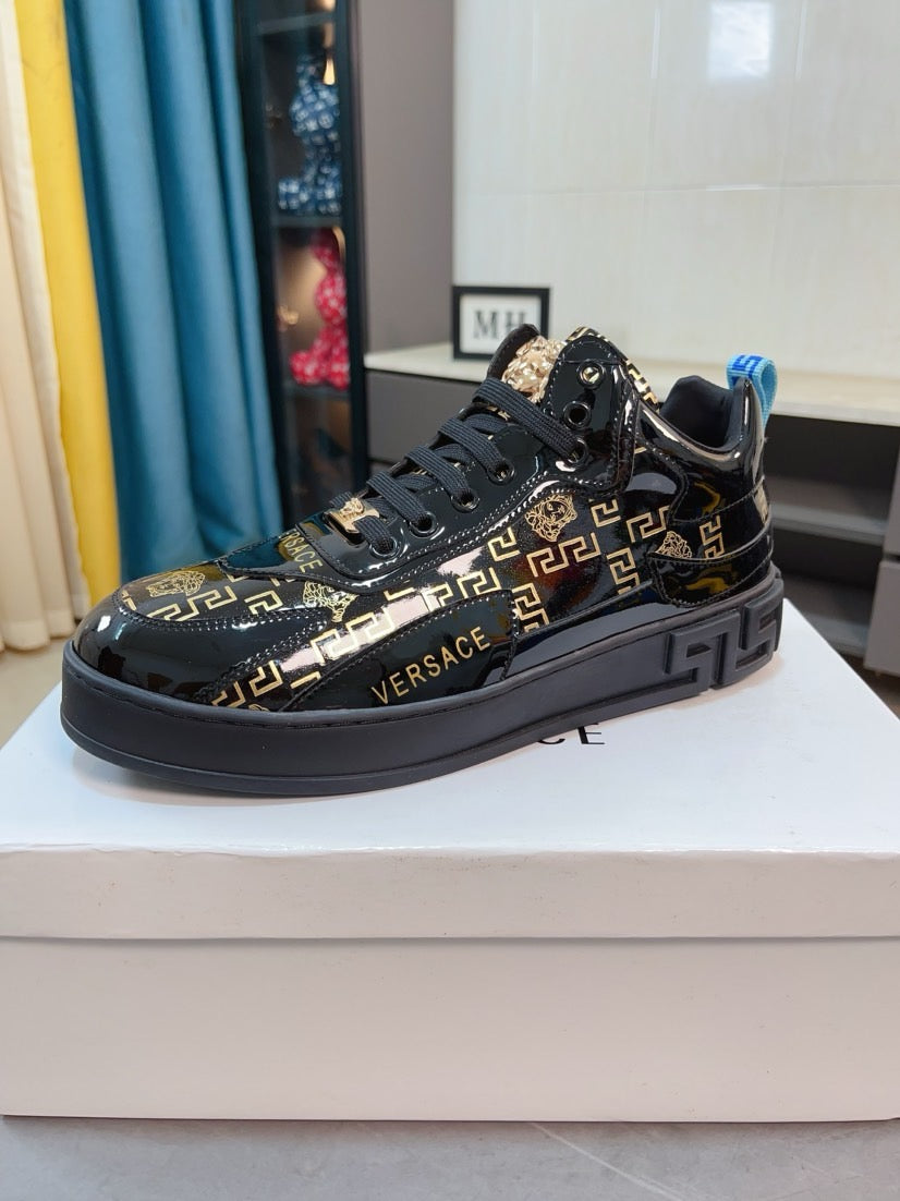 Black Versace high-top sneakers with gold Greca print, chunky sole, blue pull tab
