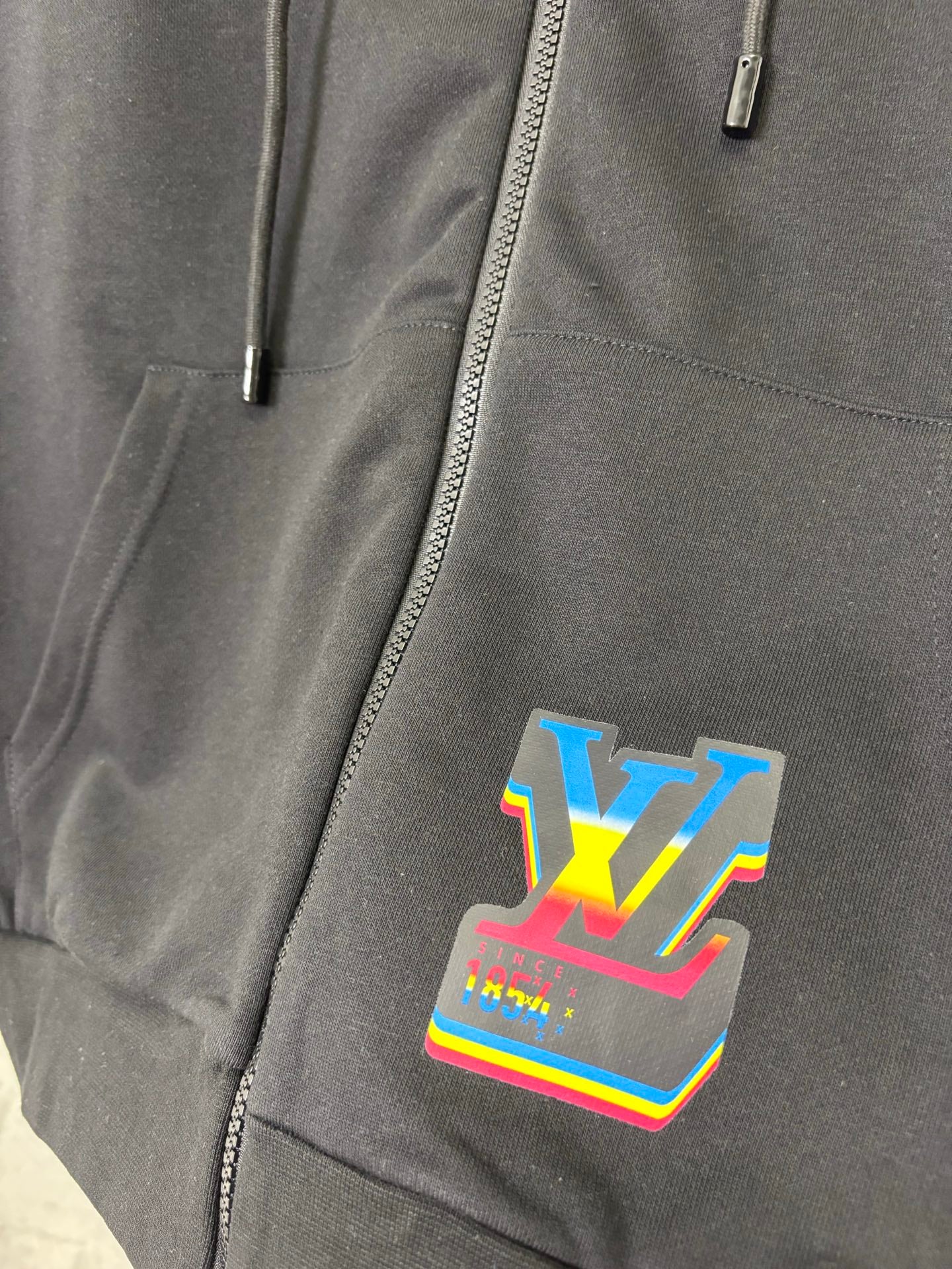 Black hoodie front zipper with colorful LV-style graphic patch