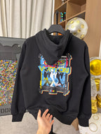 Black zip-up hoodie with colorful front graphic, hood, and drawstring