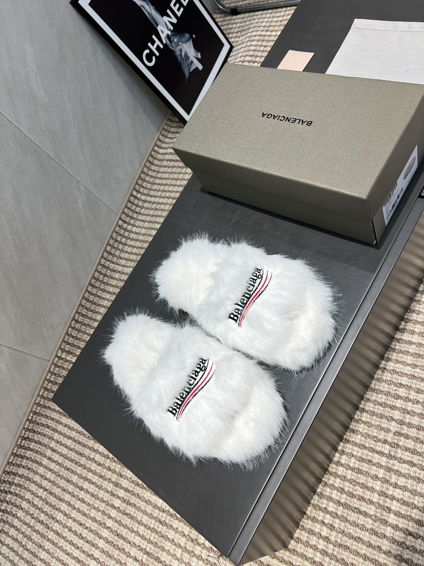White fur slide sandals with crossed straps and Balenciaga logo