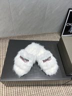 White fur slide sandals, top view with Balenciaga logo straps