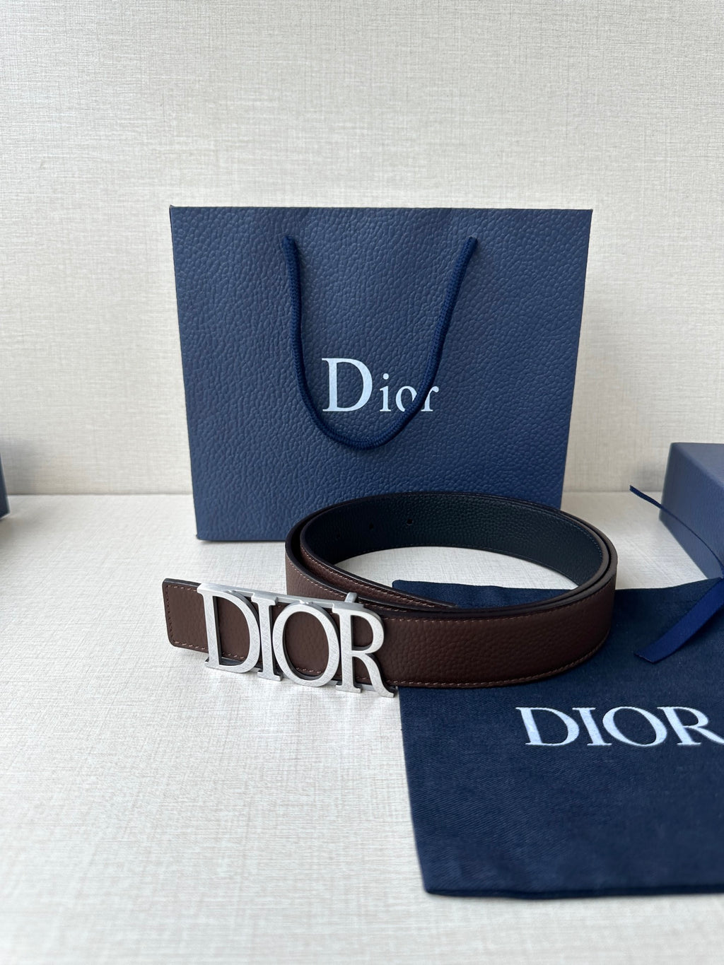 Brown leather belt with Dior buckle and engraved metal letters