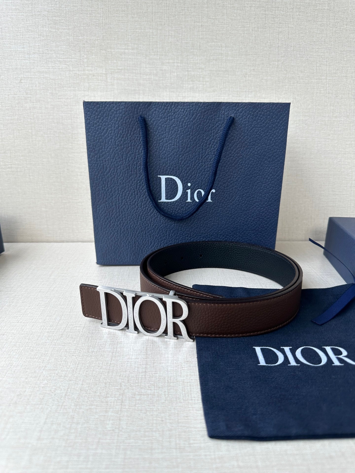 Brown leather belt with Dior buckle and engraved metal letters