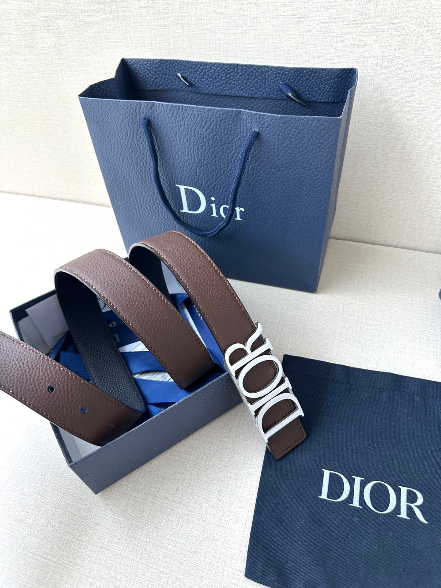 Brown leather belt with wide Dior buckle and metal loops