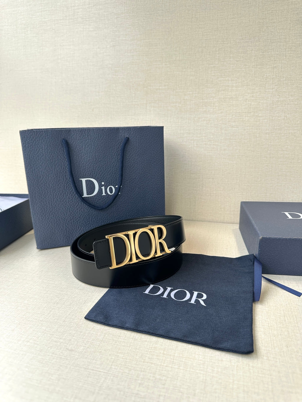 Black leather Dior belt with gold-tone Dior buckle and Dior strap lettering