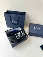 Black leather Dior belt with Dior logo buckle and wrapped strap loop