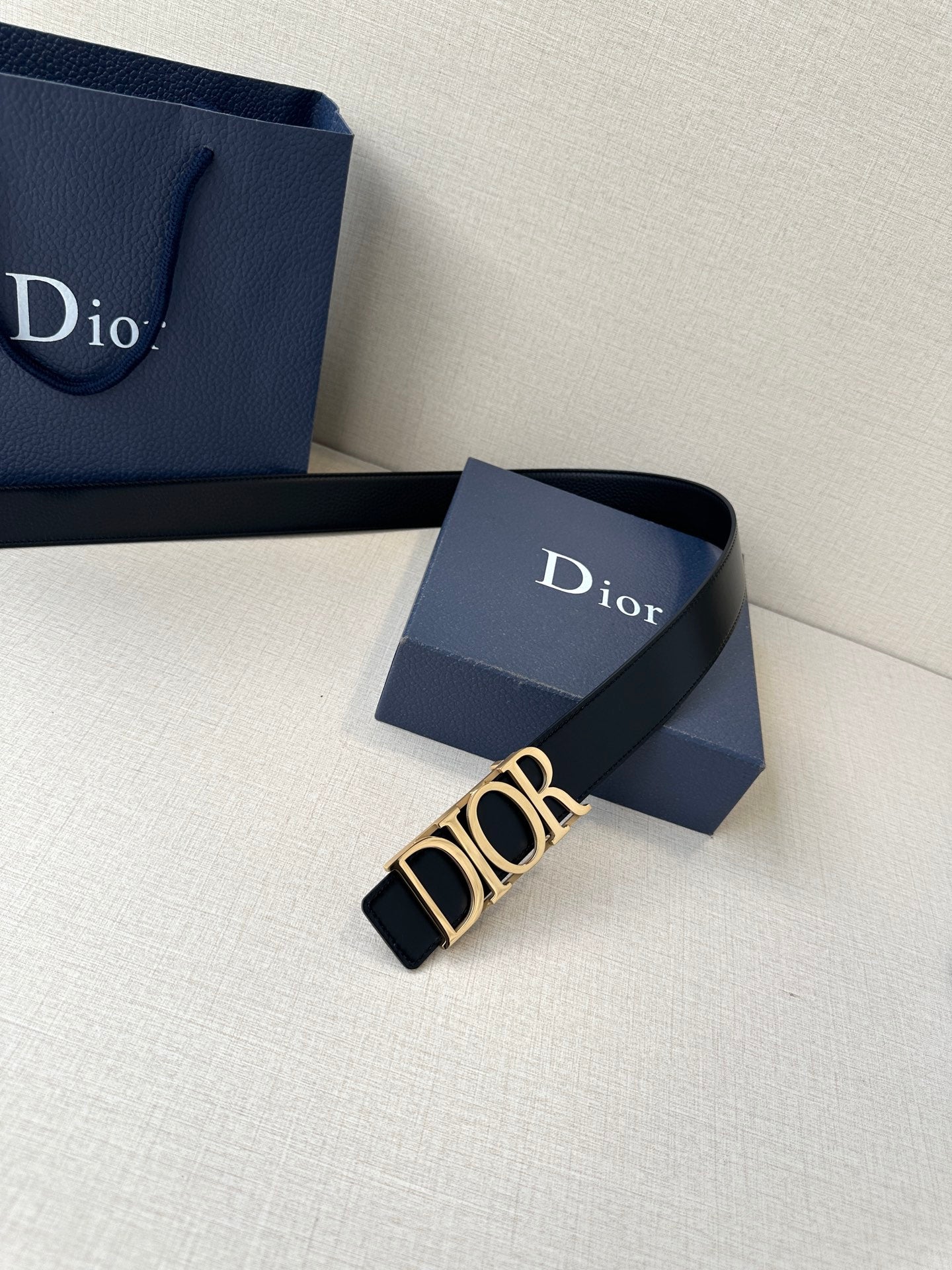 Black leather Dior belt with gold-tone Dior buckle and small eyelets