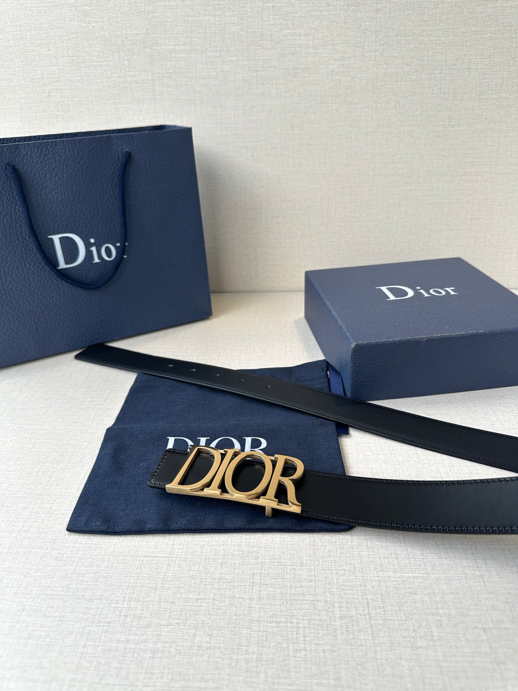 Black leather Dior belt with wide Dior logo buckle and smooth strap