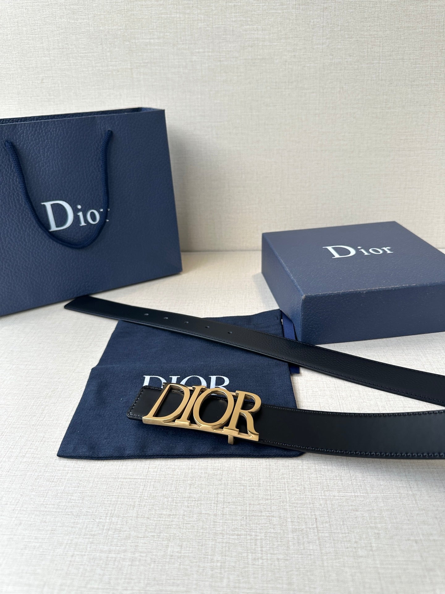 Black leather Dior belt with wide Dior logo buckle and smooth strap
