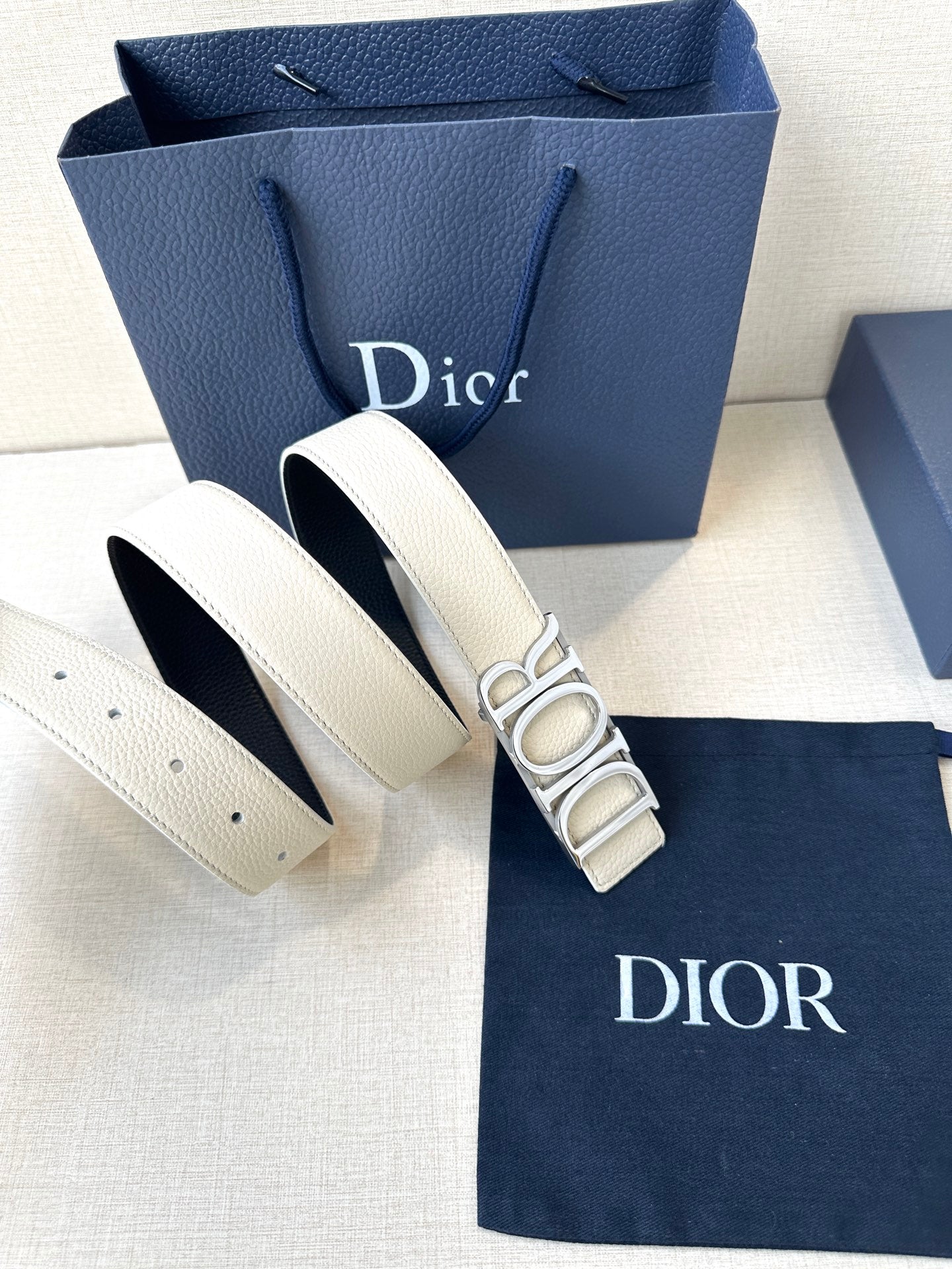 Dior white leather belt with large Dior logo buckle and adjustable holes