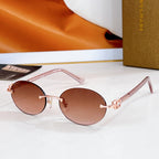 Bvlgari round sunglasses, light rose frame, rose-brown tinted lenses, gold-tone details