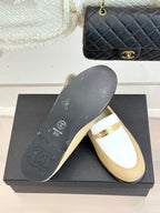 Chanel women's loafer outsole and top, cream leather with white strap and gold buckle
