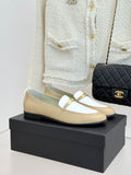 Chanel women's loafers in cream and white with gold buckle strap