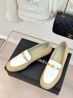 Chanel women's loafers, cream uppers with white strap and gold metal buckle