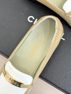 Chanel women's loafer close-up of interior, cream lining with white vamp and buckle