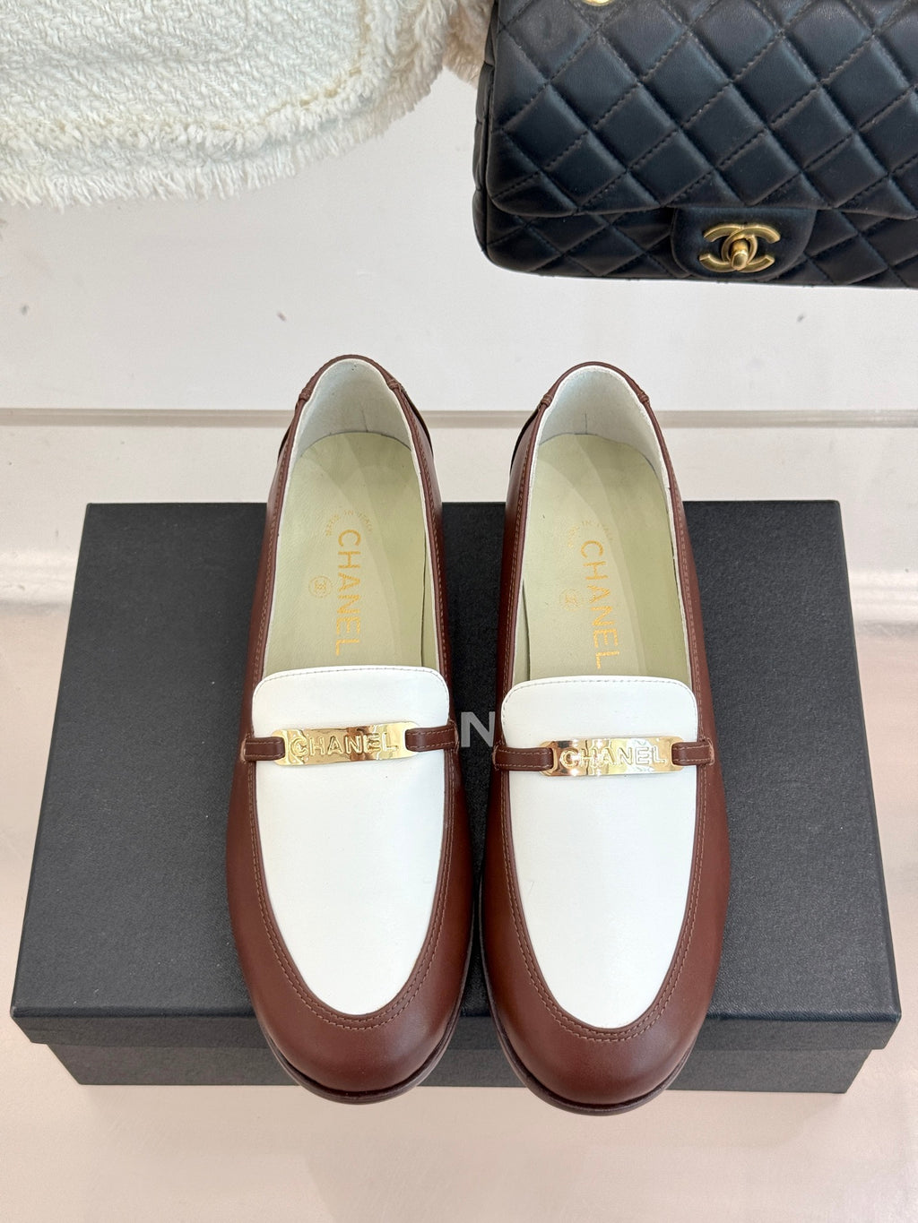 Chanel ladies luxury loafers, brown with white upper and gold buckle hardware