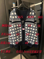 Zip-up hooded jacket with lattice pattern and dark center panel, shown on hanger