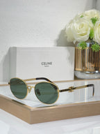 Gold round sunglasses with dark green-tinted lenses and metal temple arms
