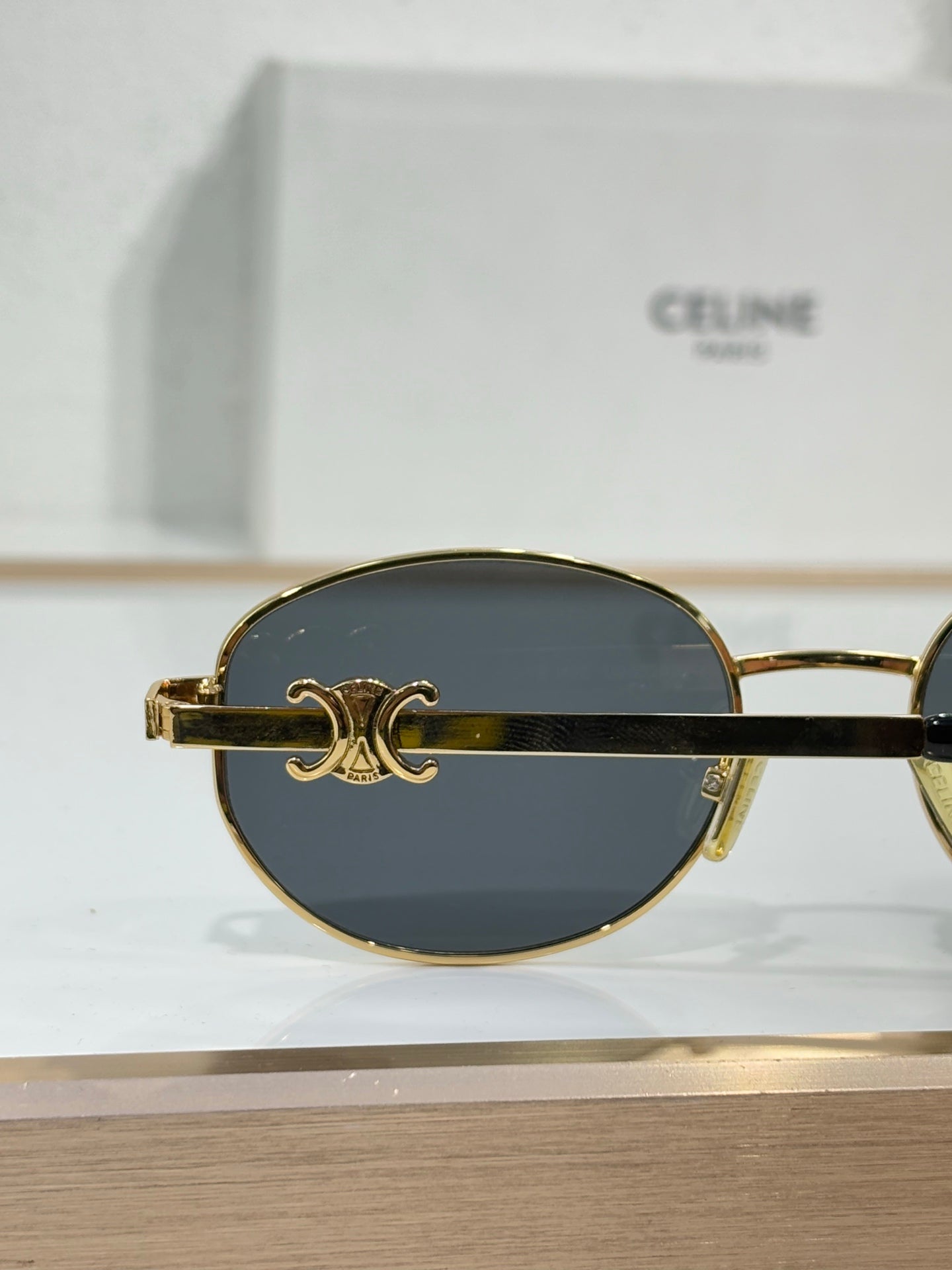 Celine round sunglasses with gold frame and dark lenses, Celine emblem detail