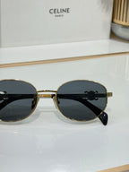 Celine round sunglasses with gold bridge and dark lenses, front view