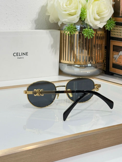 Celine round sunglasses with gold frame, dark lenses, and black temple arms