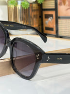 Celine black sunglasses with patterned temple detail