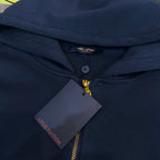 Navy Louis Vuitton hoodie with hood, gold zipper, and hanging price tag