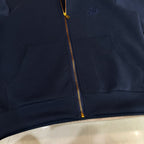 Navy Louis Vuitton zip-up hoodie with front pocket, small chest logo, and gold zipper