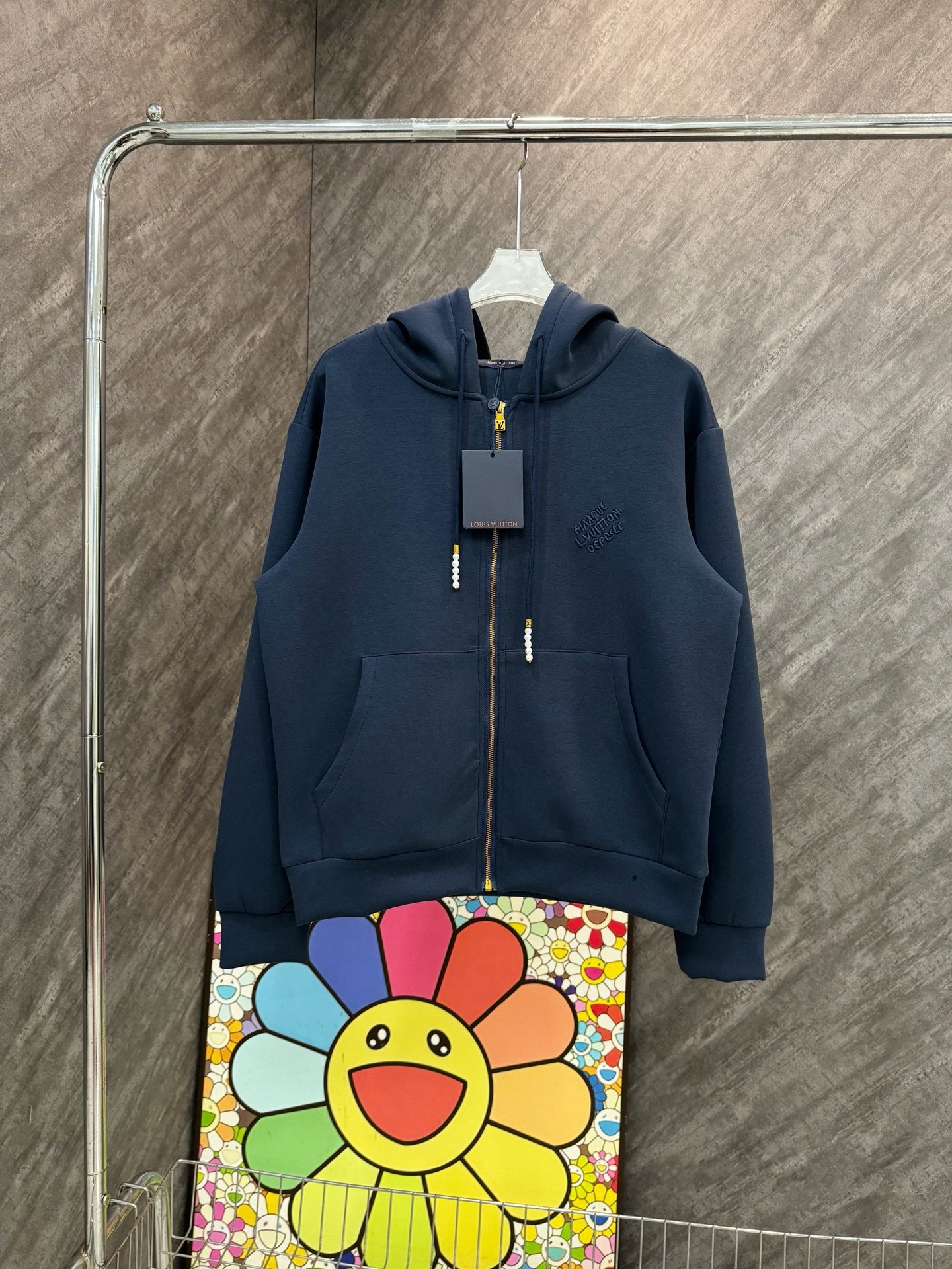 Navy Louis Vuitton zip-up hoodie with hood, gold zipper, and logo chest embroidery