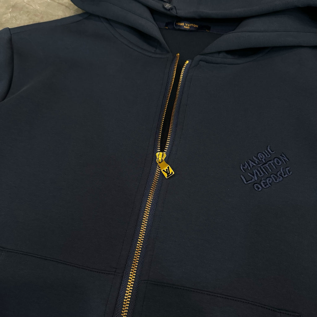 Navy Louis Vuitton zip-up hoodie with gold zipper and gold LV zipper pull