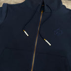 Navy Louis Vuitton zip-up hoodie with hood drawstrings, gold zipper, and chest logo