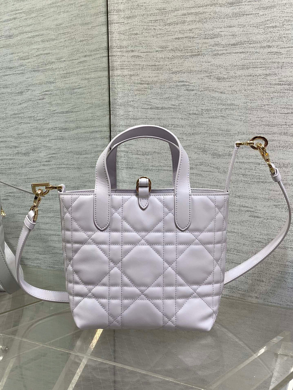 Dior quilted mini handbag with top handle and crossbody strap in light white