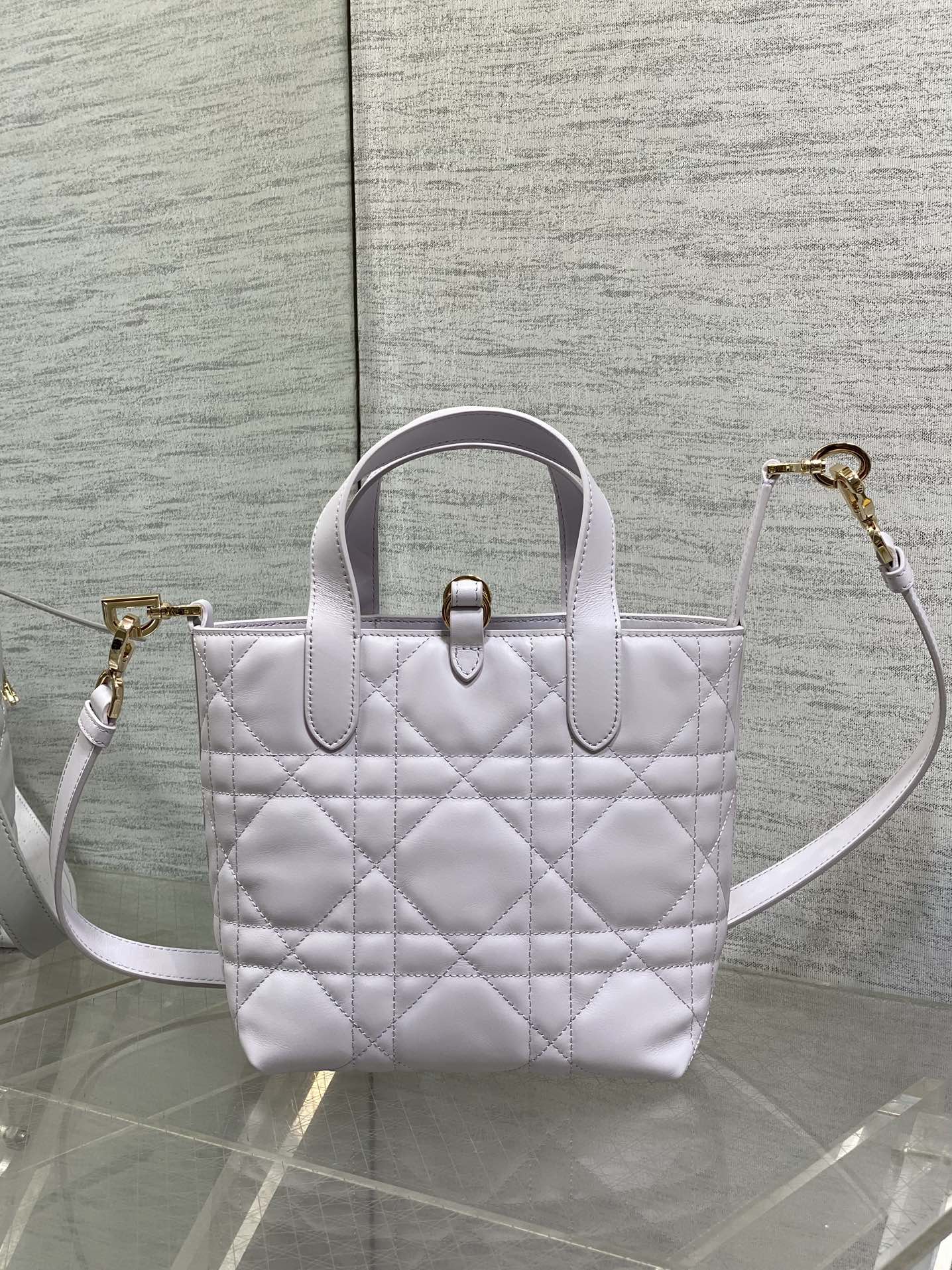 Dior quilted mini handbag with top handle and crossbody strap in light white