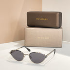BVLGARI cat-eye sunglasses with silver frame and dark gray tinted lenses