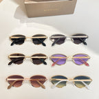 BVLGARI cat-eye sunglasses set with mixed frames and tinted lenses on display