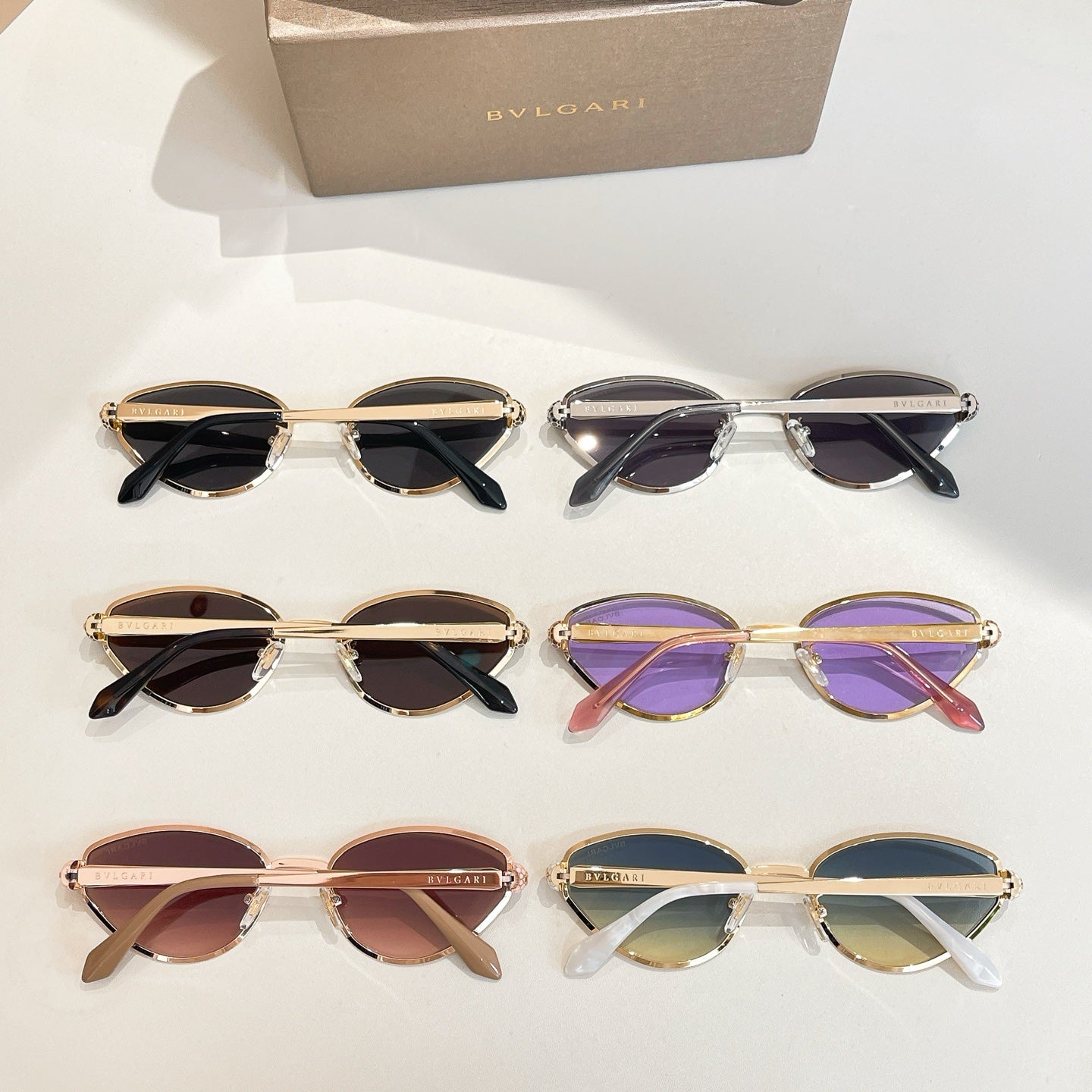 BVLGARI cat-eye sunglasses set with mixed frames and tinted lenses on display