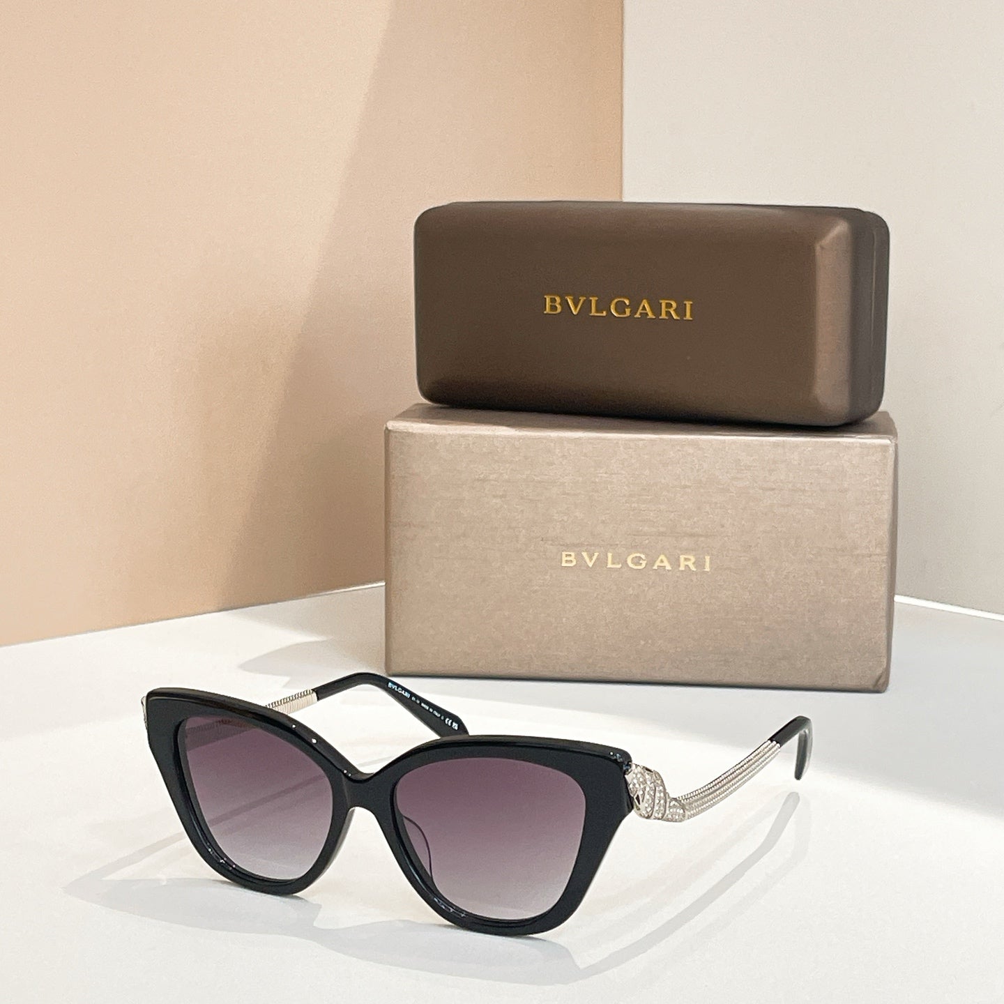 Bvlgari sunglasses with black frame and dark purple tinted lenses