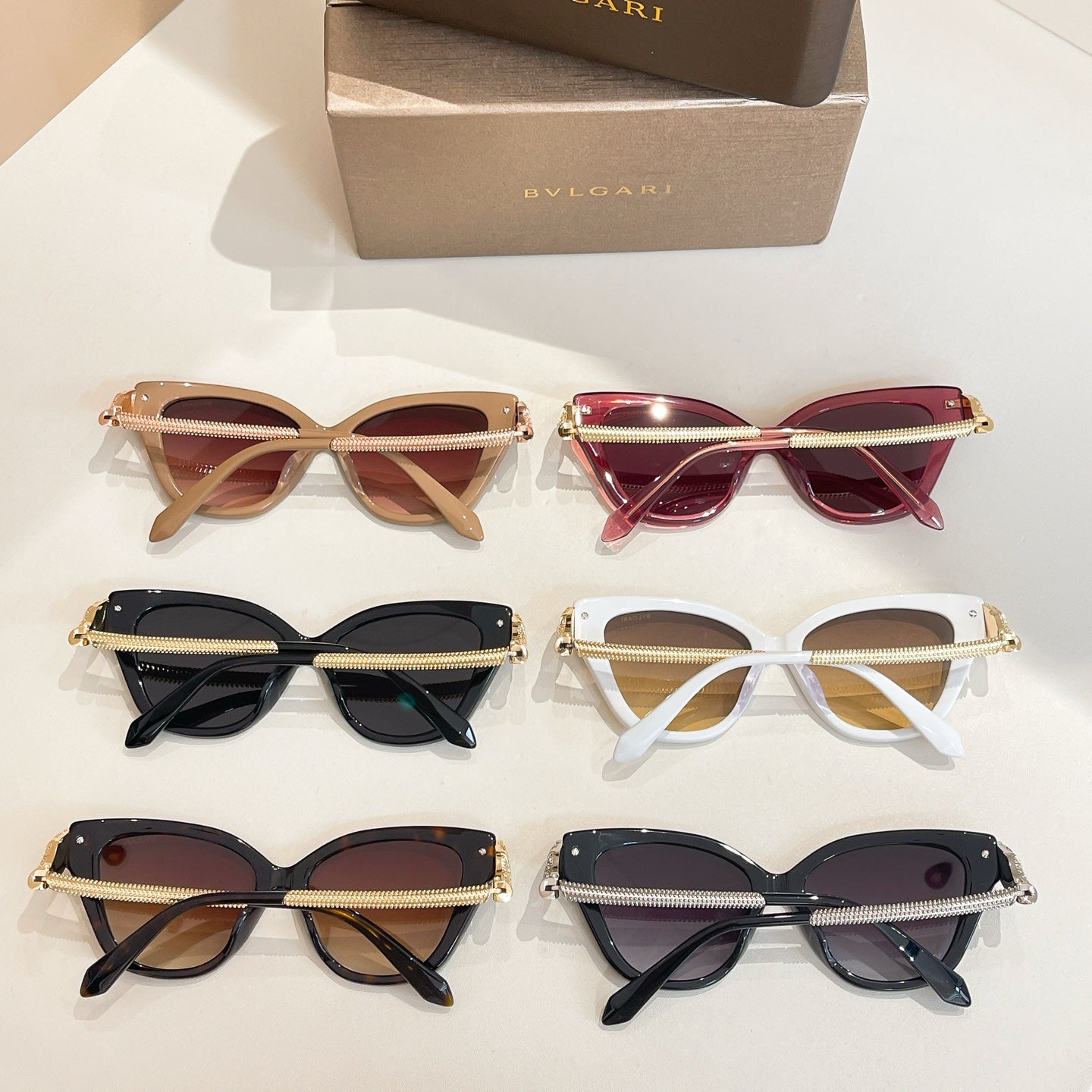 Set of Bvlgari sunglasses with gold-accent temples and mixed tinted lenses