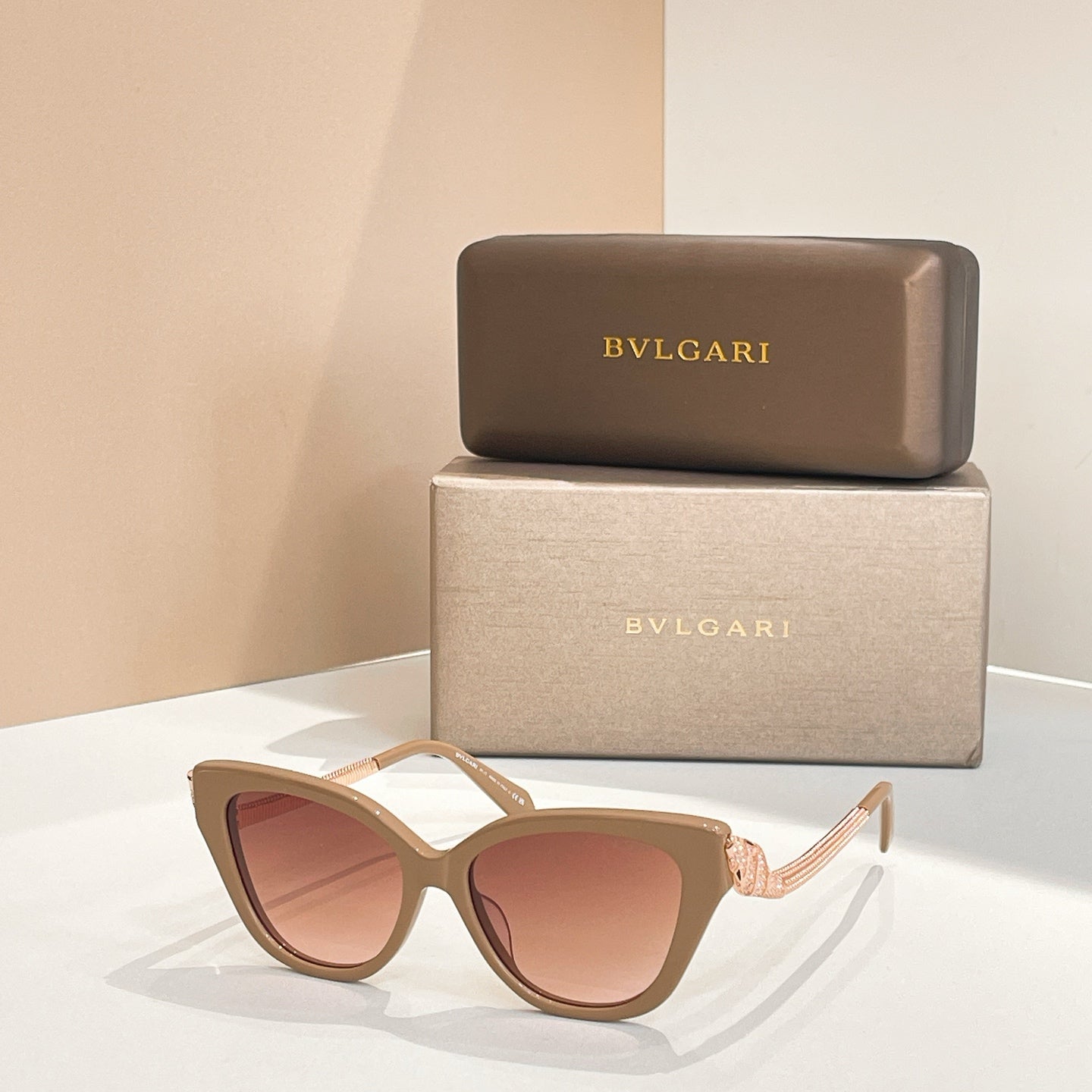 Bvlgari sunglasses with cream frame and rose tinted lenses