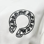 White sweatshirt chest graphic: circular black logo print