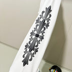 White sweatshirt sleeve with large black decorative floral line art