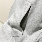 Gucci long-sleeve hoodie sleeve and side seam, heather gray knit with stitched hem