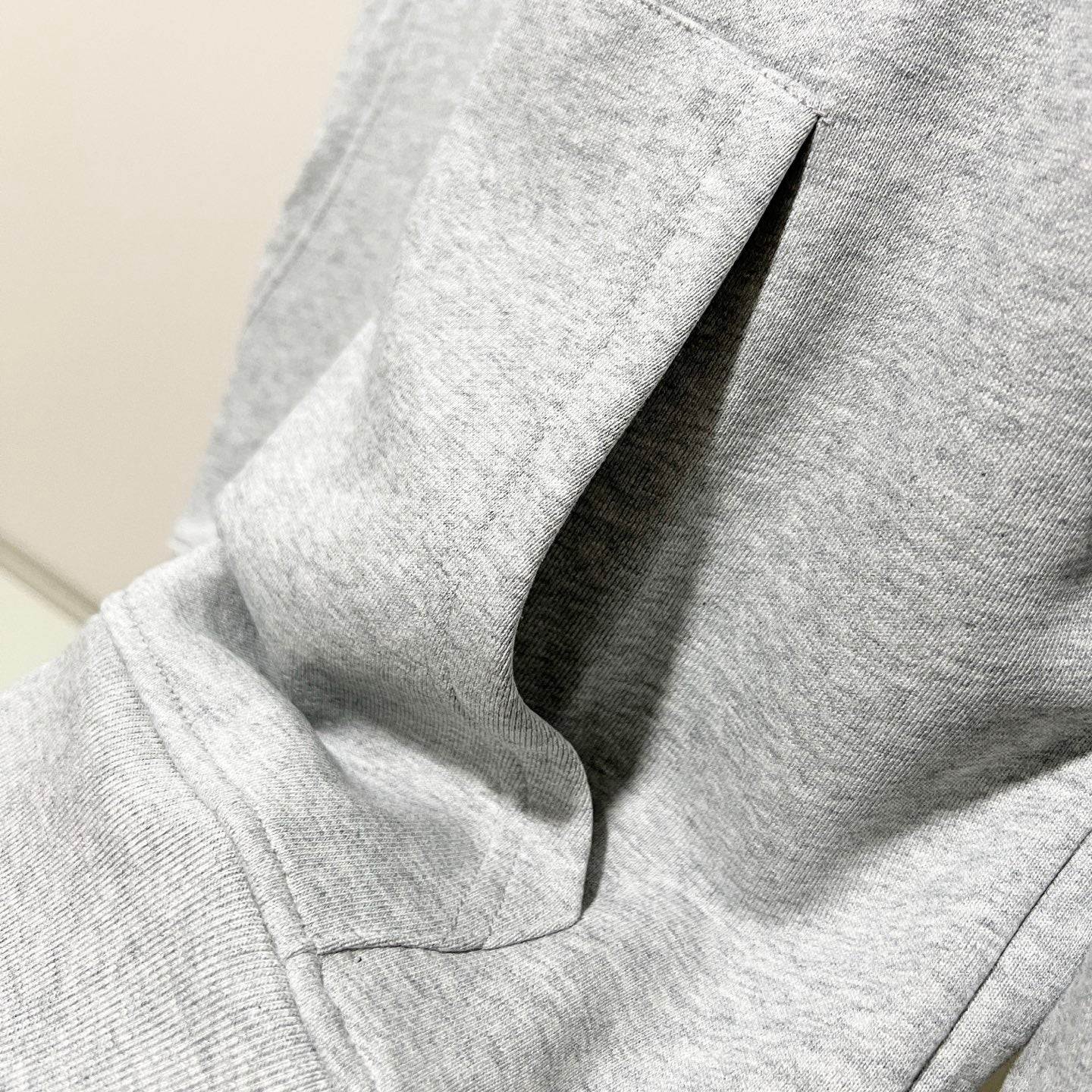 Gucci long-sleeve hoodie sleeve and side seam, heather gray knit with stitched hem