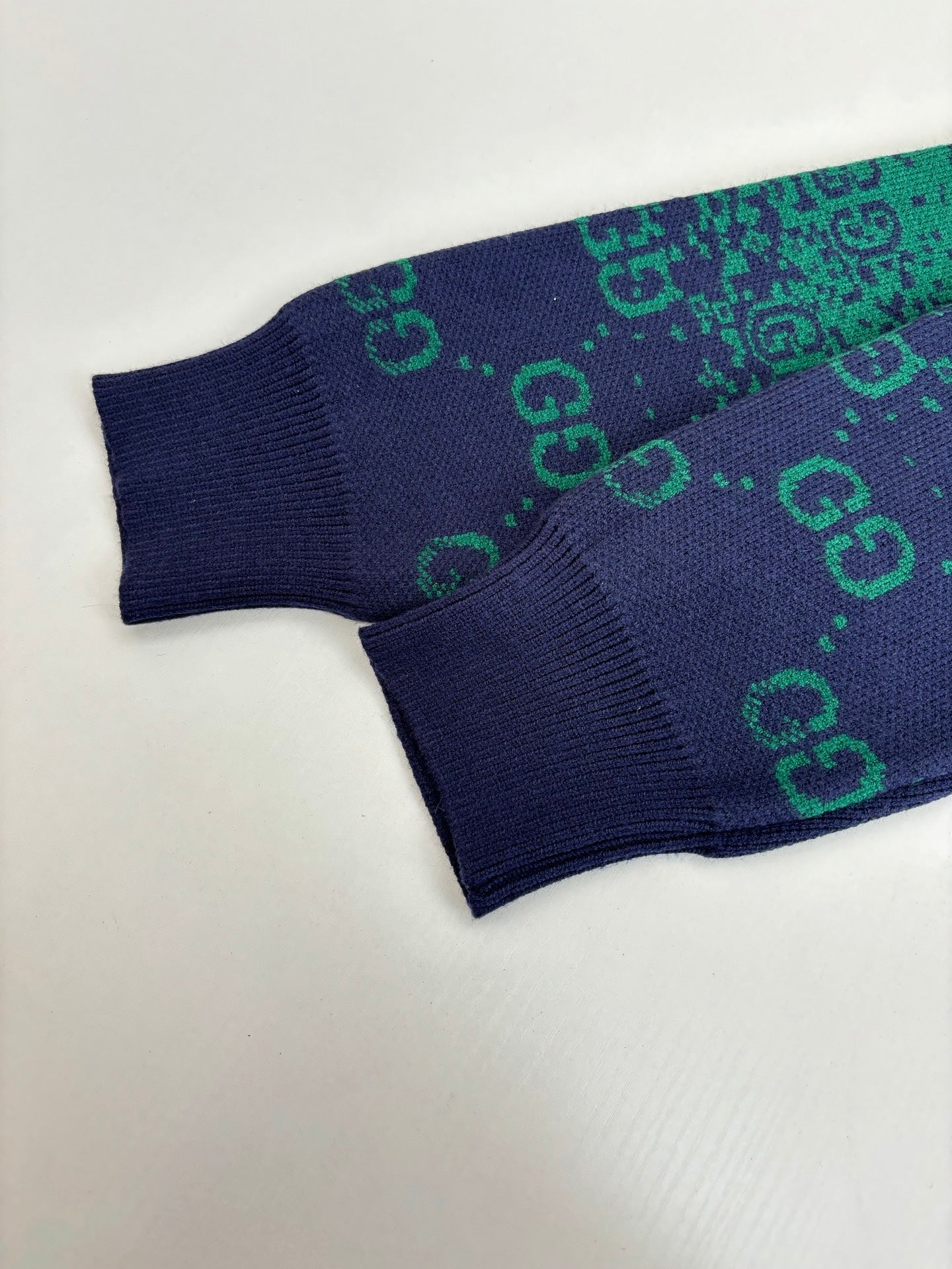 Gucci long cardigan hem and sleeve end, navy ribbed cuffs with green GG print