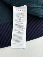 Gucci long cardigan care label on green and navy GG jacquard knit fabric