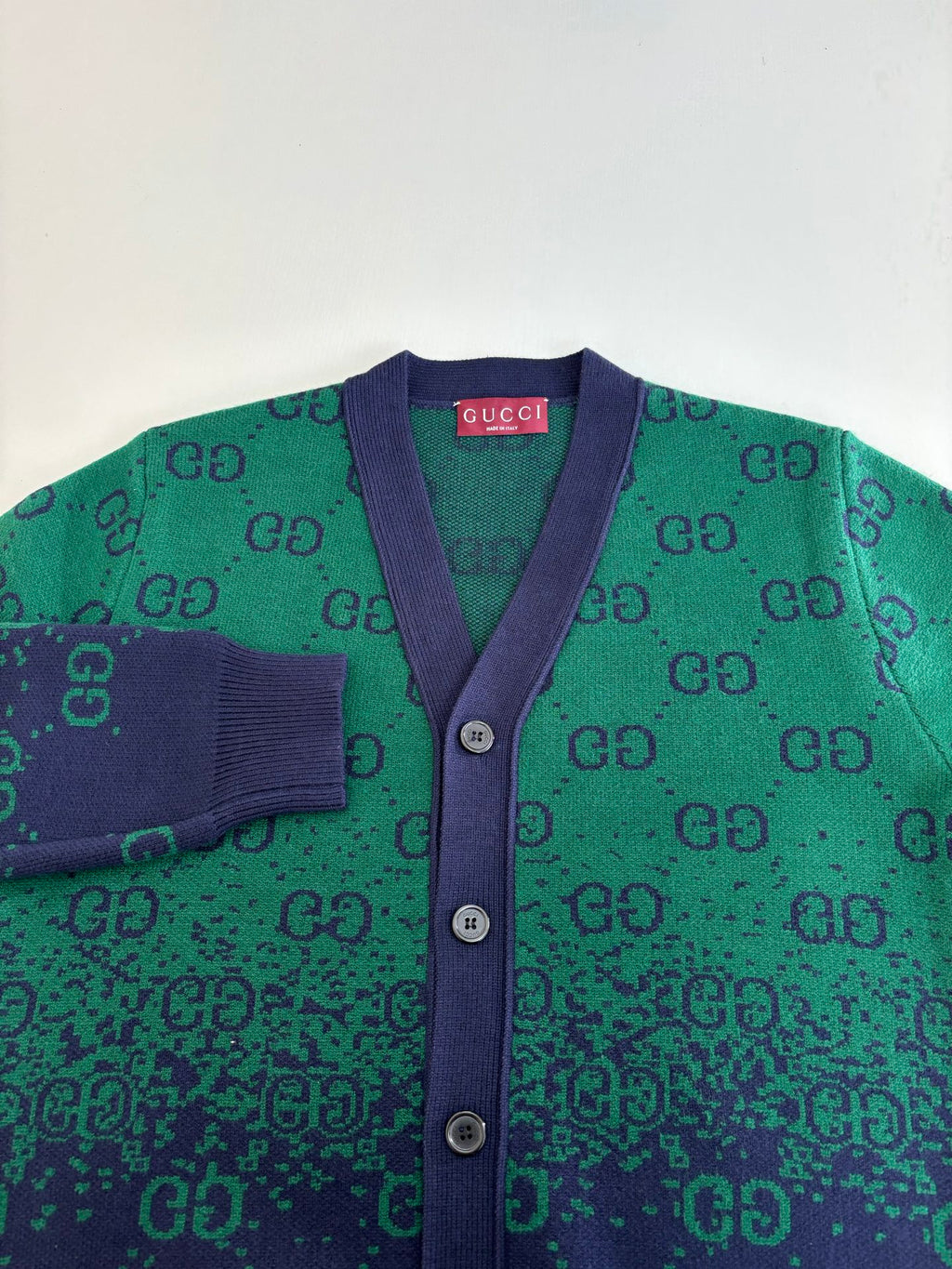 Gucci long cardigan detail: purple placket, green GG jacquard knit, button front